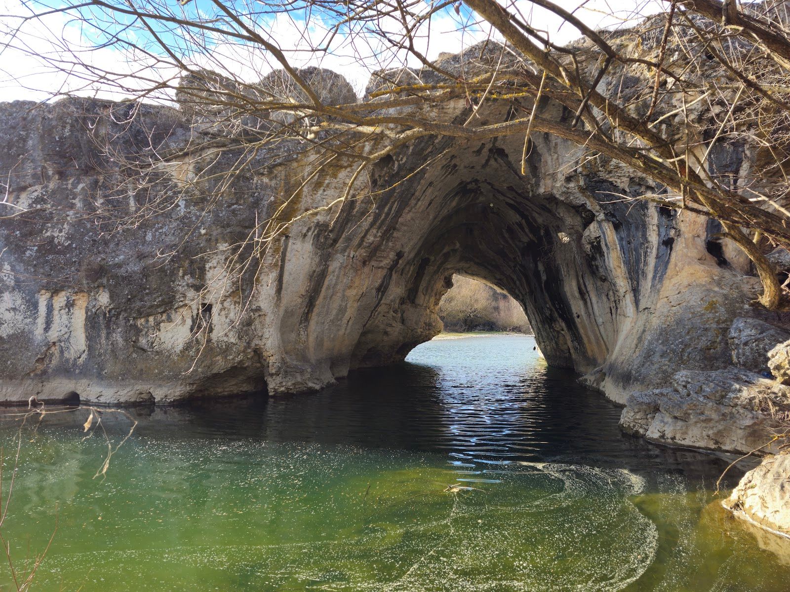 Natural stone arch on the river Vit